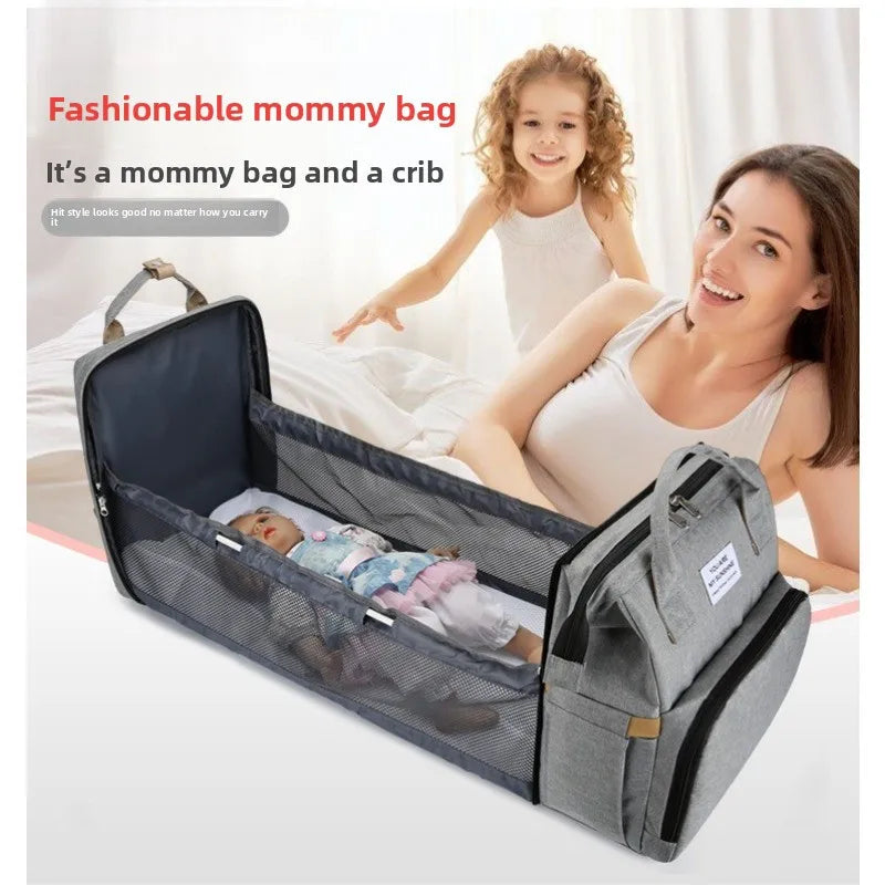 A nova cama dobrável tipo mochila de 2025 é uma cama portátil para bebês, ideal para viagens e passeios, além de ser uma cama tipo mochila resistente à pressão.