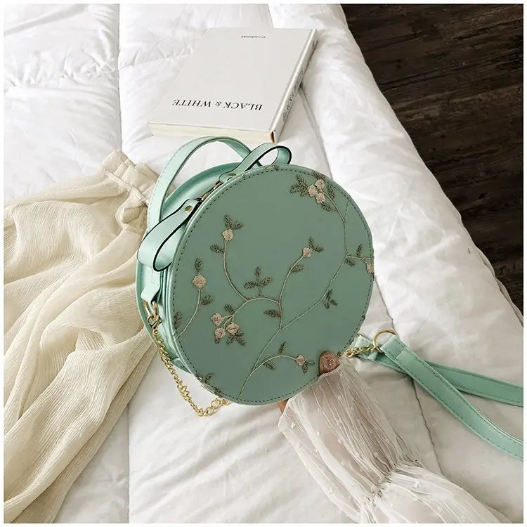 Bolsas redondas de renda doce de couro PU de alta qualidade para mulheres, bolsas crossbody para mulheres 2025, pequena corrente de flores frescas, ombro