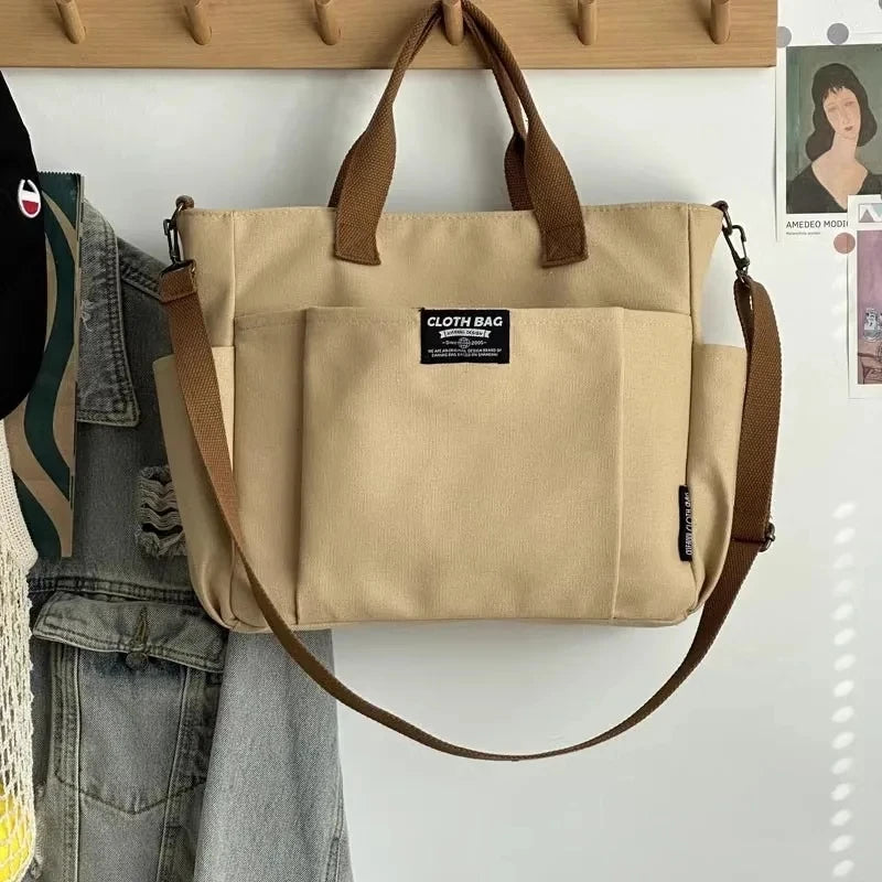 Bolsa tote portátil urbana minimalista, grande capacidade, para estudantes, de lona horizontal, com um ombro, diagonal e transversal